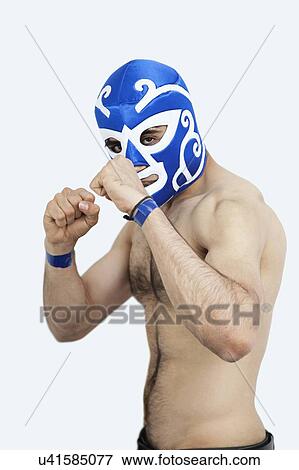 Stock Photo - Portrait of a young shirtless male wrestler over gray background. Fotosearch