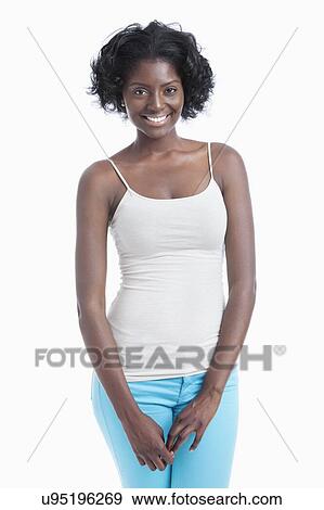 Portrait of an African American young woman standing over white background View Large Photo Image Stock Photo - Portrait of an African American young woman standing over white background. Fotosearch
