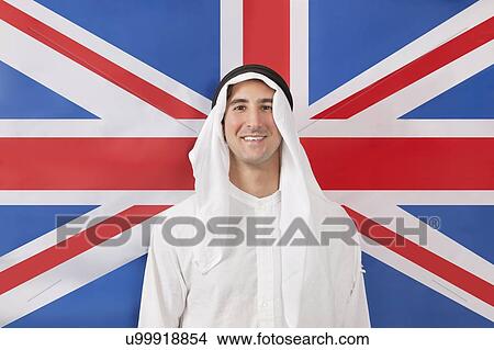 Portrait of an Arab man in traditional clothes against American flag View Large Photo Image Picture - Portrait of an Arab man in traditional clothes against American flag. Fotosearch
