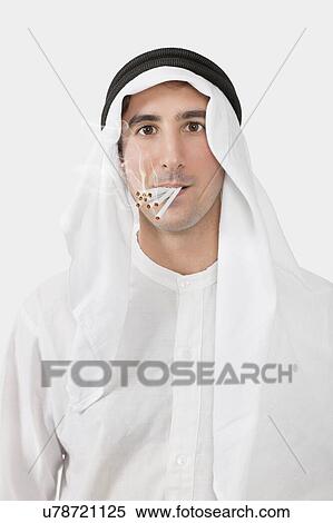 Portrait of an Arab man smoking cigarettes over white background View Large Photo Image Stock Photography - Portrait of an Arab man smoking cigarettes over white background. Fotosearch