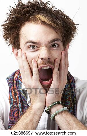 Portrait of angry young man screaming against white background View Large Photo Image Stock Photo - Portrait of angry young man screaming against white background. Fotosearch