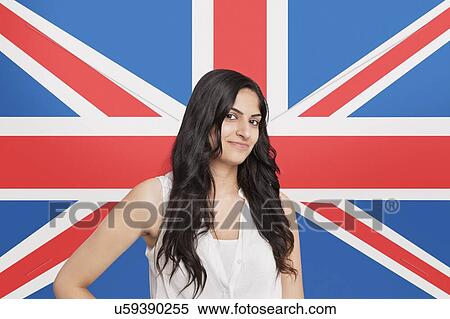 Portrait of beautiful Asian woman smiling against British flag View Large Photo Image Stock Photography - Portrait of beautiful Asian woman smiling against British flag. Fotosearch