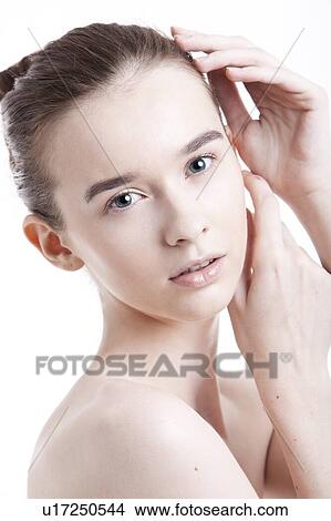 Portrait of beautiful young woman against white background View Large Photo Image Picture - Portrait of beautiful young woman against white background. Fotosearch