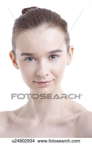 Portrait of beautiful young woman smiling against white background View Large Photo Image Picture - Portrait of beautiful young woman smiling against white background. Fotosearch