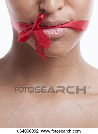 Portrait of beautiful young woman with blue eyeshadow against white background View Large Photo Image Stock Image - Portrait of beautiful young woman with blue eyeshadow against white background. Fotosearch