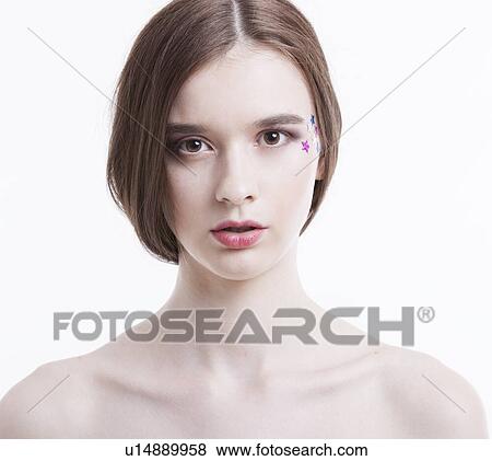 Portrait of beautiful young woman with stars on her face against white background View Large Photo Image Stock Photo - Portrait of beautiful young woman with stars on her face against white background. Fotosearch