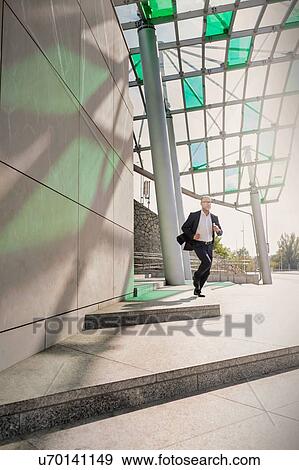 Portrait of businessman running for emergency View Large Photo Image Stock Photo - Portrait of businessman running for emergency. Fotosearch