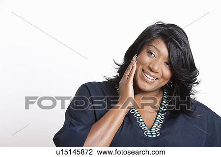Stock Image - Portrait of casual mixed race woman over white background. Fotosearch