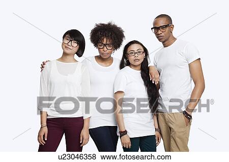 Stock Photo - Portrait of confident multi-ethnic friends in casuals standing together over white background. Fotosearch