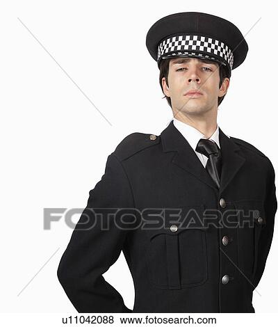 Portrait of confident police officer against white background View Large Photo Image Stock Photo - Portrait of confident police officer against white background. Fotosearch