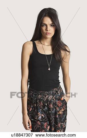 Stock Photo - Portrait of cool young woman over white background. Fotosearch