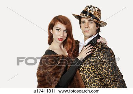 Portrait of couple in fur costume over gray background View Large Photo Image Stock Image - Portrait of couple in fur costume over gray background. Fotosearch