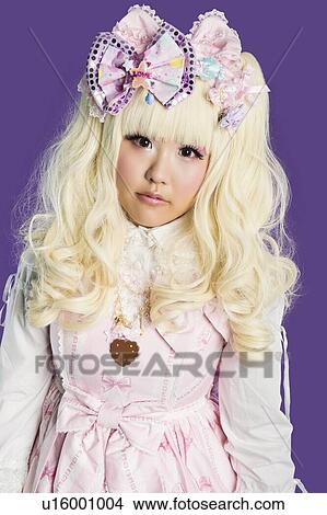 Portrait of cute woman in doll costume over colored background View Large Photo Image Picture - Portrait of cute woman in doll costume over colored background. Fotosearch