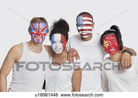 Portrait of happy Multi-ethnic group of friends with various national flags painted on their faces standing against white background View Large Photo Image Stock Photo - Portrait of happy Multi-ethnic group of friends with various national flags painted on their faces standing against white background. Fotosearch
