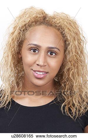 Portrait of happy young mixed race woman with blond curly hair against white background View Large Photo Image Stock Photography - Portrait of happy young mixed race woman with blond curly hair against white background. Fotosearch