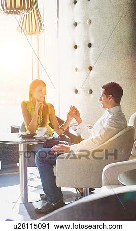 Portrait of man and attractive woman dating in coffee shop View Large Photo Image Stock Image - Portrait of man and attractive woman dating in coffee shop. Fotosearch