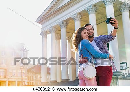 Portrait of Man taking selfie with his girlfriend View Large Photo Image Stock Image - Portrait of Man taking selfie with his girlfriend. Fotosearch