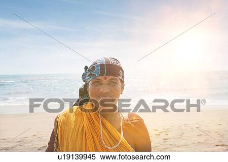 Portrait of mature Indian woman smiling View Large Photo Image Stock Photography - Portrait of mature Indian woman smiling. Fotosearch