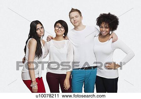 Stock Image - Portrait of multi-ethnic friends in casuals smiling over white background. Fotosearch
