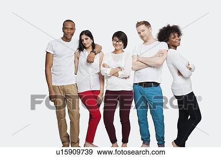 Portrait of multi-ethnic friends in casuals standing together over white background View Large Photo Image Stock Photo - Portrait of multi-ethnic friends in casuals standing together over white background. Fotosearch