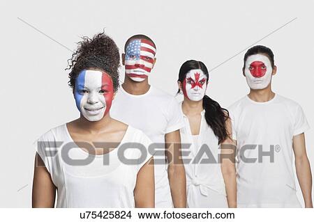 Picture - Portrait of Multi-ethnic group of friends with various national flags painted on their faces standing against white background. Fotosearch