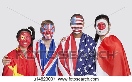 Stock Photo - Portrait of multi-ethnic group with national flags and face painting against white background. Fotosearch