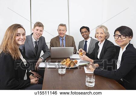 Portrait of multiethnic professionals in meeting at conference room View Large Photo Image Stock Photograph - Portrait of multiethnic professionals in meeting at conference room. Fotosearch