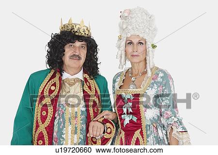 Portrait of senior king and queen standing over gray background View Large Photo Image Stock Image - Portrait of senior king and queen standing over gray background. Fotosearch
