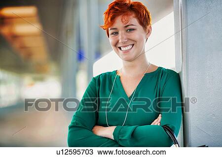 Portrait of smiling confident businesswoman standing with arms crossed View Large Photo Image Stock Image - Portrait of smiling confident businesswoman standing with arms crossed. Fotosearch