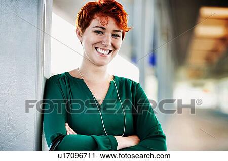 Portrait of smiling confident businesswoman standing with arms crossed View Large Photo Image Stock Image - Portrait of smiling confident businesswoman standing with arms crossed. Fotosearch