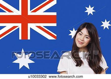 Portrait of smiling mixed race young woman against Australian flag View Large Photo Image Stock Image - Portrait of smiling mixed race young woman against Australian flag. Fotosearch