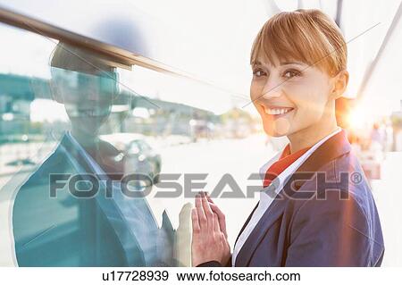Portrait of smiling young attractive flight attendant in airport View Large Photo Image Stock Photo - Portrait of smiling young attractive flight attendant in airport. Fotosearch