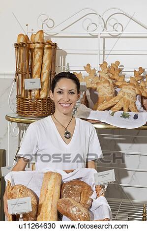 Portrait of woman in bakery with fresh breads View Large Photo Image Stock Image - Portrait of woman in bakery with fresh breads. Fotosearch