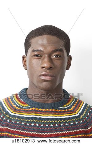 Portrait of young African American man in knitwear against white background View Large Photo Image Stock Image - Portrait of young African American man in knitwear against white background. Fotosearch