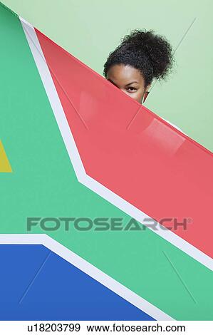 Portrait of young African American woman with South African flag against green background View Large Photo Image Stock Photo - Portrait of young African American woman with South African flag against green background. Fotosearch