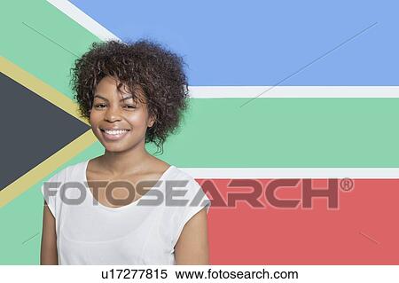 Portrait of young African American woman in white t-shirt smiling against South African flag View Large Photo Image Stock Photography - Portrait of young African American woman in white t-shirt smiling against South African flag. Fotosearch