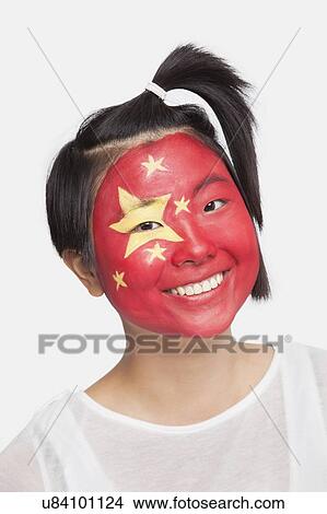 Portrait of young Asian woman with Chinese flag painted on face against white background View Large Photo Image Picture - Portrait of young Asian woman with Chinese flag painted on face against white background. Fotosearch
