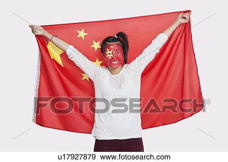 Portrait of young Asian woman with Chinese flag and painted face against white background View Large Photo Image Stock Photo - Portrait of young Asian woman with Chinese flag and painted face against white background. Fotosearch