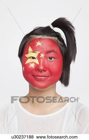 Portrait of young Asian woman with Chinese flag painted on face against white background View Large Photo Image Stock Photo - Portrait of young Asian woman with Chinese flag painted on face against white background. Fotosearch
