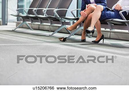 Portrait of young attractive airport staffs talking and sitting while on break in airport View Large Photo Image Stock Photograph - Portrait of young attractive airport staffs talking and sitting while on break in airport. Fotosearch