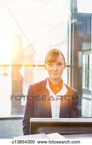 Portrait of young attractive passenger service agent standing in airport gate View Large Photo Image Stock Image - Portrait of young attractive passenger service agent standing in airport gate. Fotosearch