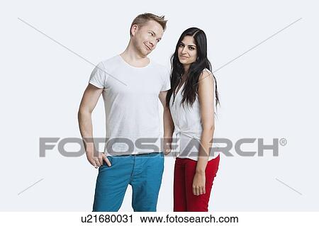 Portrait of young couple in casuals over white background View Large Photo Image Stock Image - Portrait of young couple in casuals over white background. Fotosearch