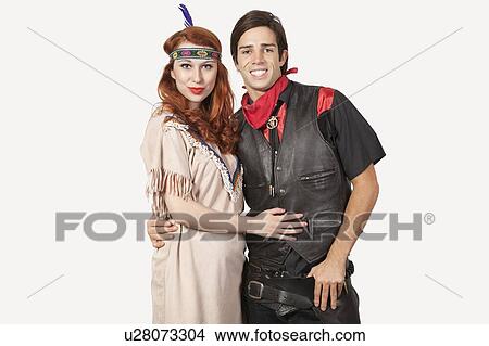 Portrait of young couple in old-fashioned costumes smiling against gray background View Large Photo Image Picture - Portrait of young couple in old-fashioned costumes smiling against gray background. Fotosearch