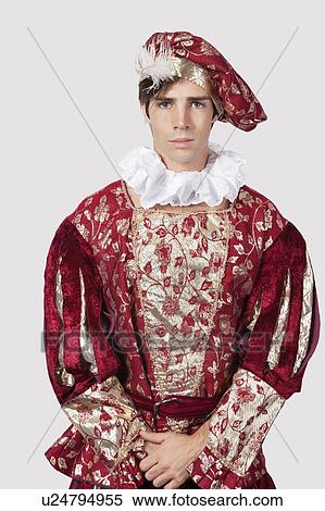 Portrait of young man in old-fashioned costume against gray background View Large Photo Image Stock Photography - Portrait of young man in old-fashioned costume against gray background. Fotosearch
