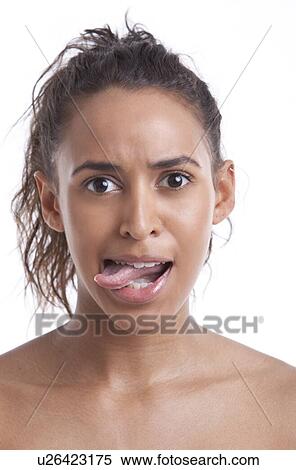 Portrait of young Mixed Race woman sticking out her tongue against white background View Large Photo Image Stock Photography - Portrait of young Mixed Race woman sticking out her tongue against white background. Fotosearch