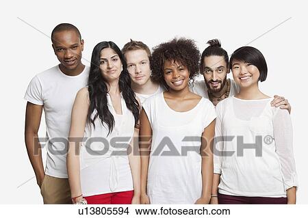 Portrait of young multi-ethnic friends smiling together over white background View Large Photo Image Picture - Portrait of young multi-ethnic friends smiling together over white background. Fotosearch