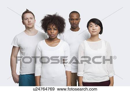 Portrait of young multi-ethnic friends in casuals standing together over white background View Large Photo Image Stock Photo - Portrait of young multi-ethnic friends in casuals standing together over white background. Fotosearch