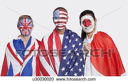 Portrait of young patriotic men with national flags and face painting smiling against white background View Large Photo Image Stock Image - Portrait of young patriotic men with national flags and face painting smiling against white background. Fotosearch