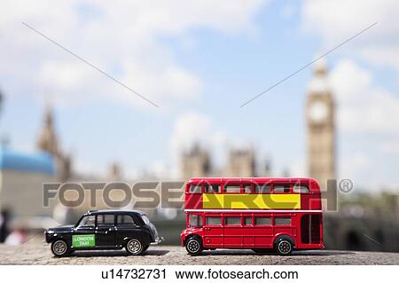 Stock Image - Public transport figurines with Big Ben Tower in the background. Fotosearch