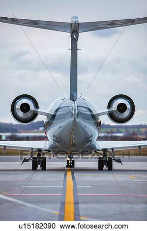 Stock Image - Rear view of airplane in airport. Fotosearch